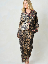 Load image into Gallery viewer, Hope & Ivy SINDY Leopard Pyjamas – women’s satin leopard print pyjama set with pink piping, button-up shirt and matching trousers. Perfect for lounging, gifting or travel.
