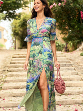 Load image into Gallery viewer, Hope & Ivy Blake Landscape Print Dress – women’s floral landscape print dress with plunge neckline, fluted lace-trim sleeves, and open back. Inspired by Monet’s gardens. Perfect for weddings and summer events.