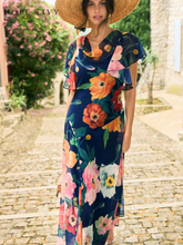 Load image into Gallery viewer, Hope & Ivy Jean Floral Dress – sustainable cowl-neck maxi dress with waterfall sleeves and hand-designed poppy print in red, pink, and orange. Made from 100% recycled materials. Perfect for weddings and summer occasions.