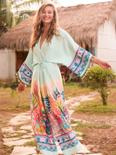 Load image into Gallery viewer, Hope & Ivy Nora Blue Kimono Sleeve Adjustable Tie Waist Midi Dress – women’s blue underwater print dress with beaded sleeves, tie waist and front split. Perfect for summer occasions and holidays.