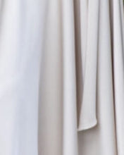 Load image into Gallery viewer, Maisonel ME3003 Oyster Dress – women’s satin occasion dress with flutter sleeves, gathered waist detail, and asymmetric hemline in elegant oyster tone. Perfect for weddings and formal events.