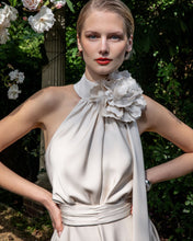 Load image into Gallery viewer, Maisonel ME3004 Oyster Dress – women’s halter neck satin occasion dress in elegant oyster tone with floral applique and asymmetric hem, perfect for weddings and formal events.