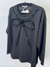 Load image into Gallery viewer, Malissa J WF2503 black sequin bow top—women’s embellished long-sleeve jersey top with statement bow detail.