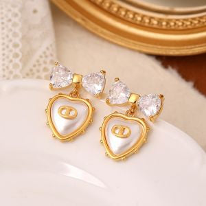 PCHA 566 Bowknot & Heart Drop Earrings – gold-tone crystal bow earrings with pearl-effect heart charm, elegant women’s statement jewellery.