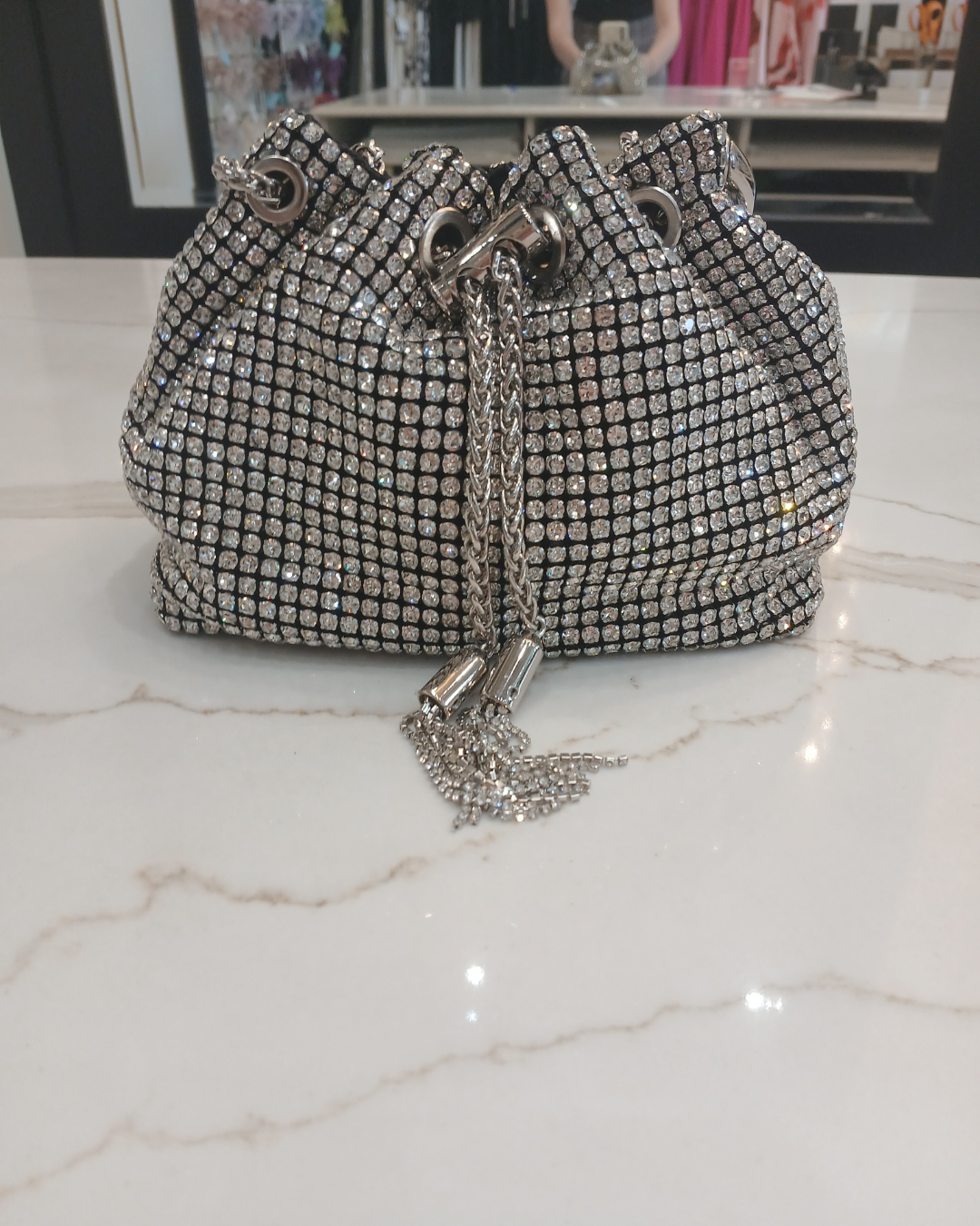 PCHA G1142 Silver Pouch Bag – embellished silver evening pouch with crystal detailing, ring handle and tassel drawstring closure, women’s statement party bag.