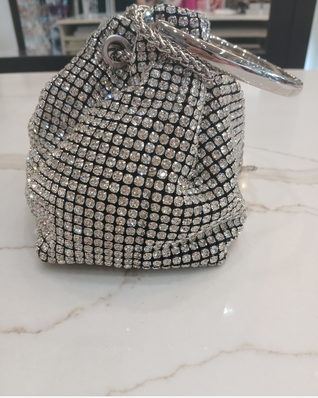 PCHA G1142 Silver Pouch Bag – embellished silver evening pouch with crystal detailing, ring handle, and tassel drawstring closure, women’s statement party bag.