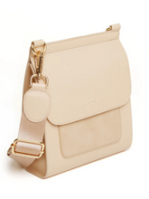 Load image into Gallery viewer, Alice Wheeler AW5969 Sand Seville Cross Body Bag – women’s sleek sand crossbody handbag with gold hardware, flap closure and adjustable strap, versatile everyday fashion accessory.
