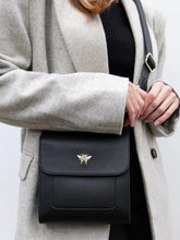 Load image into Gallery viewer, ALICE WHEELER AW5571 black Bloomsbury cross body bag in vegan leather with gold hardware, magnetic flap closure and adjustable strap.
