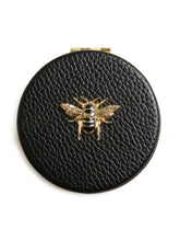 Load image into Gallery viewer, ALICE WHEELER AW5807 black round compact mirror with vegan leather cover, honey bee emblem, dual magnification, 7cm purse size.
