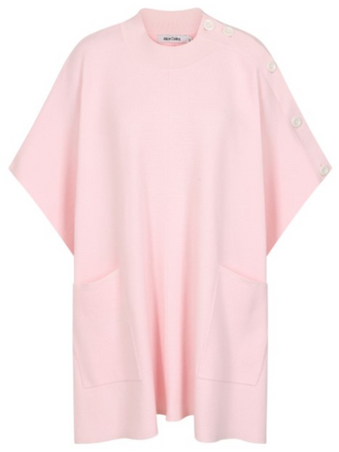 Cape by Alice Collins featuring button detailing on the shoulder, patch pockets, and a high neckline – soft lightweight knit ideal for layering and casual everyday wear.