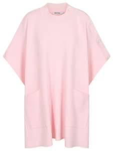 Cape by Alice Collins featuring button detailing on the shoulder, patch pockets, and a high neckline – soft lightweight knit ideal for layering and casual everyday wear.