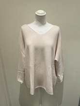 Load image into Gallery viewer, Cream long sleeve knit top by Deck by Decollage, featuring a relaxed silhouette and asymmetric hem
