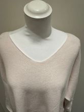Load image into Gallery viewer, Cream long sleeve knit top by Deck by Decollage, featuring a relaxed silhouette and asymmetric hem
