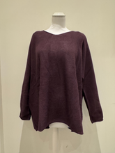 Load image into Gallery viewer, The knit top features a relaxed silhouette, soft texture, and full-length sleeves in a deep mulberry hue, designed for effortless layering and cosy everyday wear.
