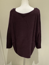 Load image into Gallery viewer, The knit top features a relaxed silhouette, soft texture, and full-length sleeves in a deep mulberry hue, designed for effortless layering and cosy everyday wear.

