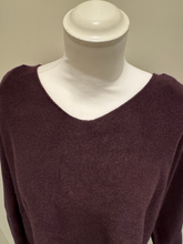 Load image into Gallery viewer, The knit top features a relaxed silhouette, soft texture, and full-length sleeves in a deep mulberry hue, designed for effortless layering and cosy everyday wear.
