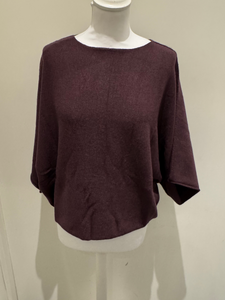 Deck by Decollage batwing knit top with a relaxed boxy fit, scoop neckline, and straight hem.