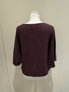 Deck by Decollage batwing knit top with a relaxed boxy fit, scoop neckline, and straight hem.