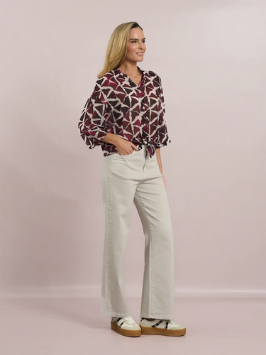 Deck by Decollage abstract print button-front blouse in berry and neutral tones, featuring a tie hem, wide sleeves, and a lightweight viscose fabric-ideal for effortless, everyday elegance.