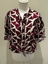 Load image into Gallery viewer, Deck by Decollage abstract print button-front blouse in berry and neutral tones, featuring a tie hem, wide sleeves, and a lightweight viscose fabric-ideal for effortless, everyday elegance.
