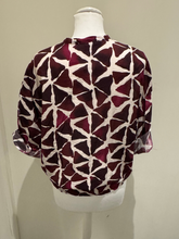 Load image into Gallery viewer, Deck by Decollage abstract print button-front blouse in berry and neutral tones, featuring a tie hem, wide sleeves, and a lightweight viscose fabric-ideal for effortless, everyday elegance.
