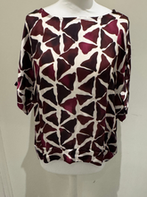 Load image into Gallery viewer, Deck by Decollage abstract Mulberry printed  top in berry and neutral tones, featuring a wide neckline and relaxed silhouette. Made from lightweight viscose for breathable comfort-perfect for bold, contemporary styling or matching co-ord looks.
