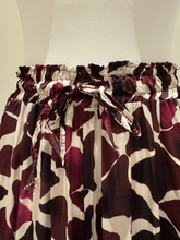 Load image into Gallery viewer, Deck by Decollage wide-leg trousers with an abstract berry and ivory print, featuring an elasticated waistband and fluid silhouette-designed for bold, stylish comfort.
