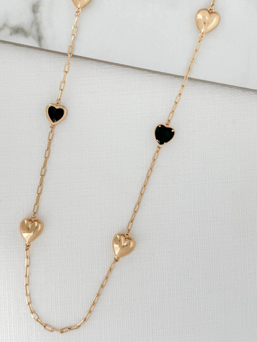 ENVY 4058/GD/N/H Necklace featuring alternating gold-effect puffed hearts and black-effect heart embellishments on a gold-effect chain, designed as a romantic and versatile accessory.