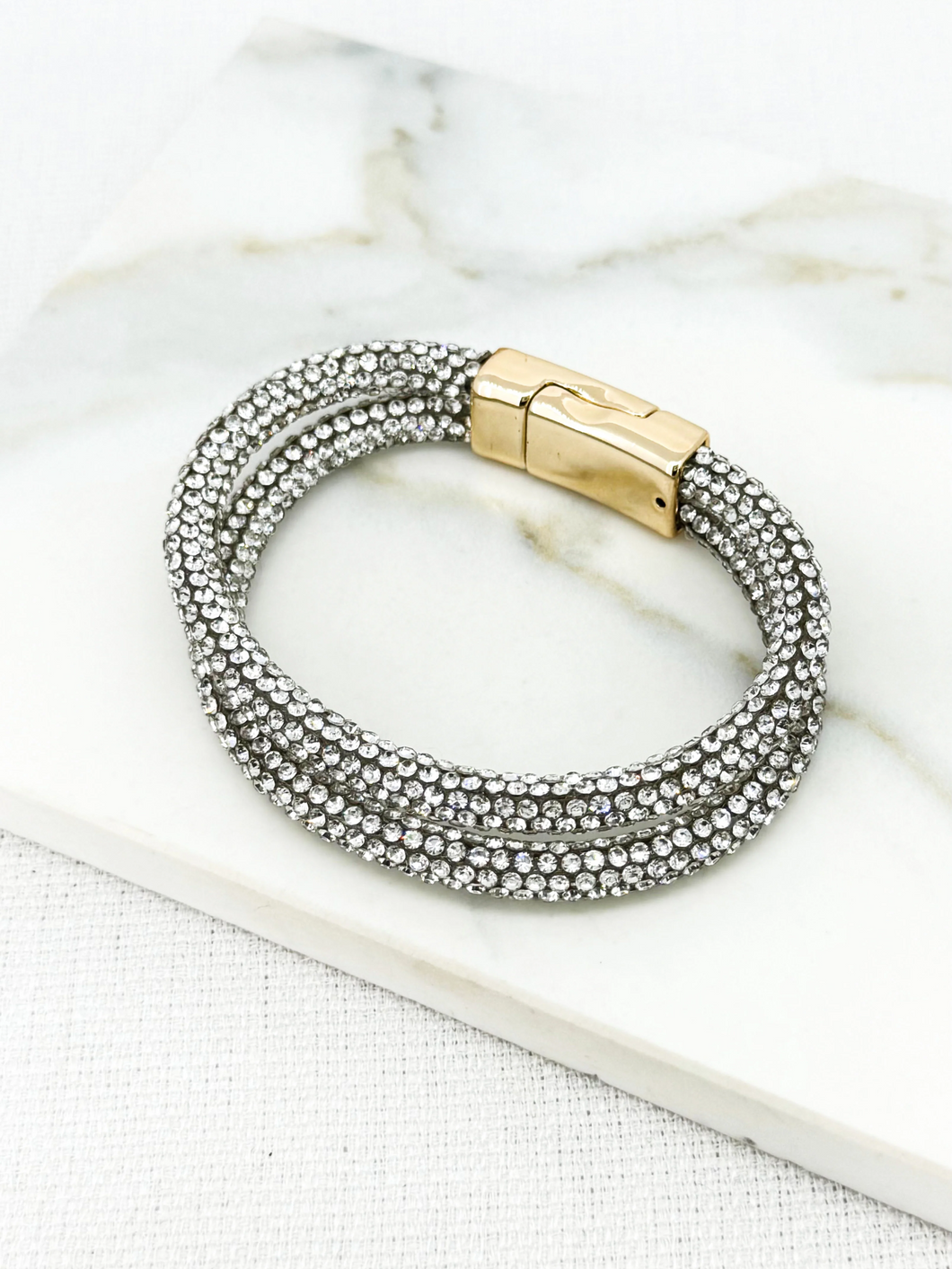 Envy 4563 Silver Bracelet featuring a silver-effect multi-strand rope design with embellishments and a gold-effect clasp, elegant women’s jewellery piece for versatile styling.