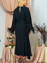 Load image into Gallery viewer, Hope &amp; Ivy HELENA black midi occasion dress with feather-trimmed sleeves and embellished bows, perfect for Christmas parties, winter weddings and evening events.
