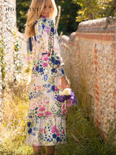 Load image into Gallery viewer, Hope &amp; Ivy Caroline White Floral Maxi Dress – sustainable women’s satin floral print dress with blouson sleeves, frilled hem and tie-back detail. Ideal for weddings, garden parties and summer occasions.

