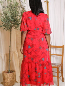 Hope & Ivy Delia Red Flutter Sleeve Maxi Wrap Dress – sustainable women’s red floral chiffon wrap dress with flutter sleeves and tie waist. Perfect for weddings, garden parties, and special occasions.