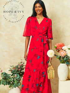 Hope & Ivy Delia Red Flutter Sleeve Maxi Wrap Dress – sustainable women’s red floral chiffon wrap dress with flutter sleeves and tie waist. Perfect for weddings, garden parties, and special occasions.