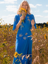 Load image into Gallery viewer, Hope &amp; Ivy Mallory Blue Embellished Wrap Dress – elegant blue embellished maxi wrap dress with silver and gold detailing, flutter sleeves, and tie waist. Perfect for weddings and evening occasions.
