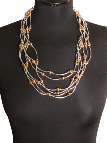 Jess & Lou NK409M Mixed Layered Multi-Strand Necklace – women’s layered necklace with silver-tone strands and gold-effect bead accents. A versatile statement piece for casual, office, or evening wear.