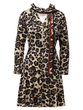 Load image into Gallery viewer, Women’s leopard print dress in beige and black with keyhole neckline and necktie, long sleeves and flattering fit-and-flare silhouette - perfect for stylish daywear or special occasions.
