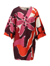 Load image into Gallery viewer, Women’s dress featuring a bold floral print in vibrant red, pink, and purple tones, with oversized batwing sleeves and a relaxed silhouette - a stylish statement dress for casual or smart occasions
