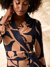 Load image into Gallery viewer, K Design B118 women’s wrap-style midi dress in abstract black and beige print with long sleeves and gathered waist, perfect for modern elegance and all-day comfort.
