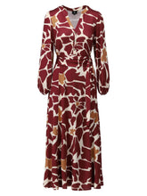 Load image into Gallery viewer, Women’s belted midi dress in burgundy and white abstract floral print with wrap waist, V-neckline and long sleeves for elegant autumn styling.
