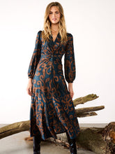 Load image into Gallery viewer, Women’s maxi dress in navy and bronze swirl print with twist-knot waist, long sleeves and flowing skirt - elegant occasion and workwear style.
