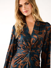 Load image into Gallery viewer, Women’s maxi dress in navy and bronze swirl print with twist-knot waist, long sleeves and flowing skirt - elegant occasion and workwear style.
