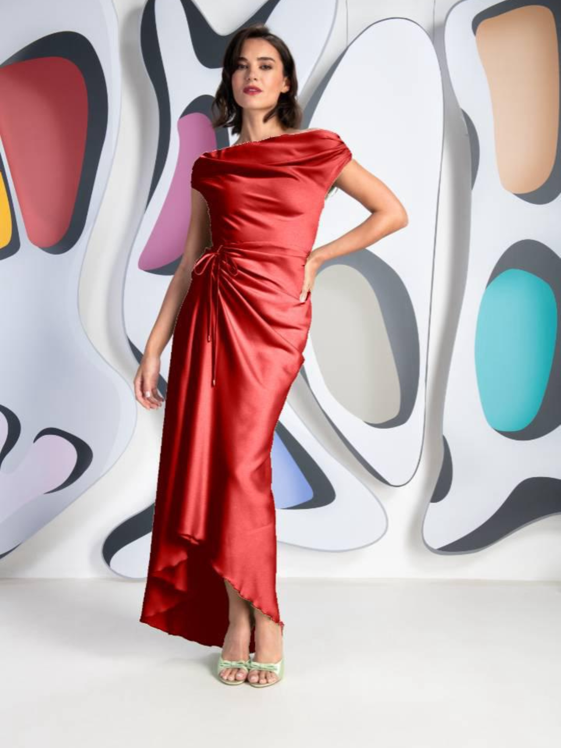 Kevan Jon Red Eugenia Bardot Asym Dress – elegant red off-the-shoulder satin gown with asymmetric draping and high-low hemline. Perfect for weddings, galas, and formal events.