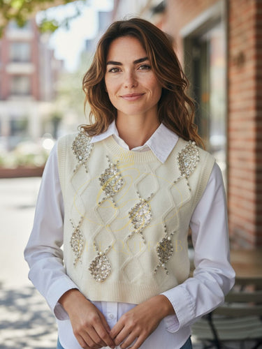 LUXTYLE TINA Ivory Sleeveless Knit 
Vest with delicate beaded embellishments, perfect for layering.