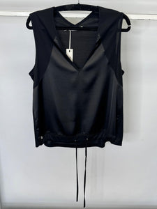 Black sleeveless top on a hanger against a white background