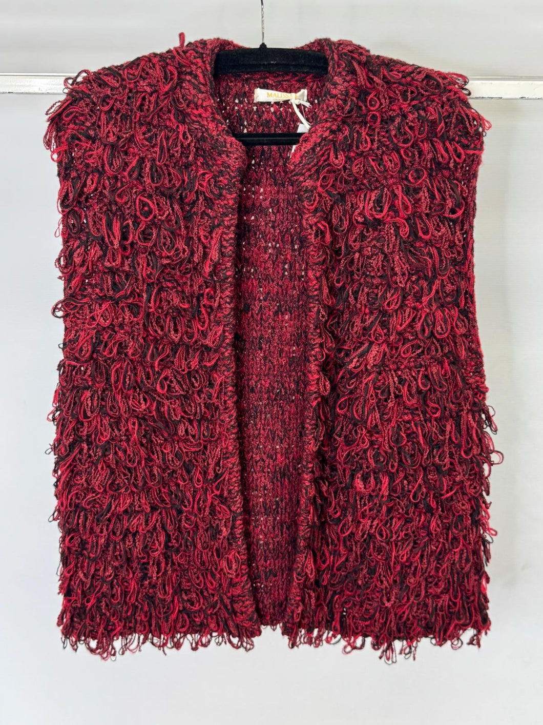 Red textured vest on a white background