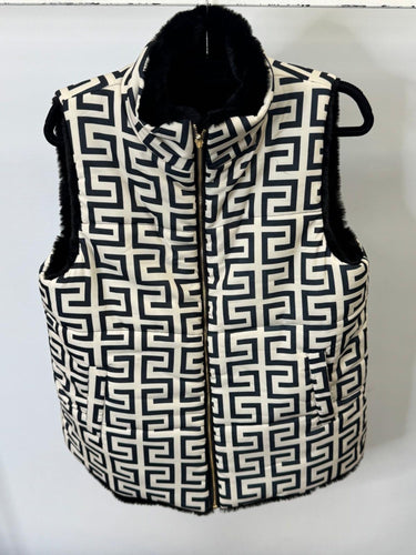 Black and white patterned vest with fur trim on a white background