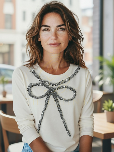 Malissa J WF2503 winter white sequin bow top—women’s embellished long-sleeve jersey top with silver bow detail.