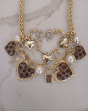 Load image into Gallery viewer, Layered gold necklace with heart and key shaped charms
