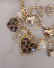 Load image into Gallery viewer, Layered gold necklace with heart and key shaped charms
