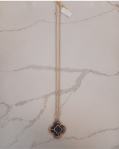 Gold necklace with a clover-shaped pendant 